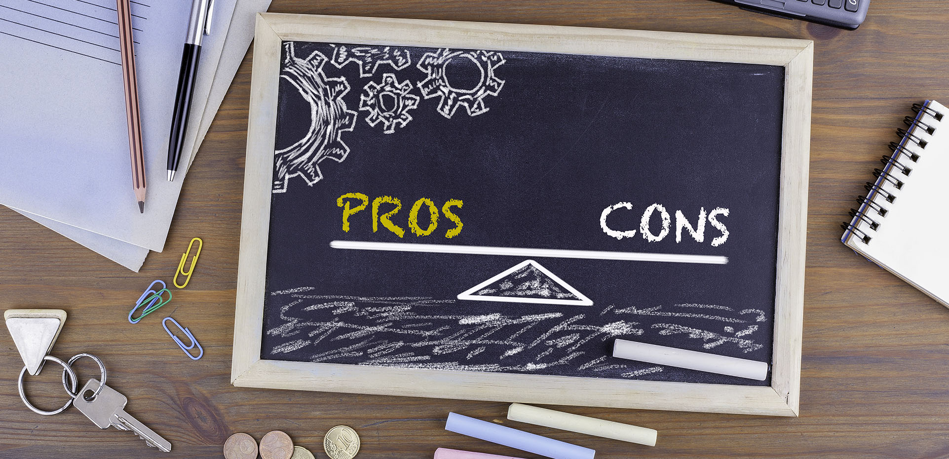 Image showing a chalk board split into "Pros" and "Cons"