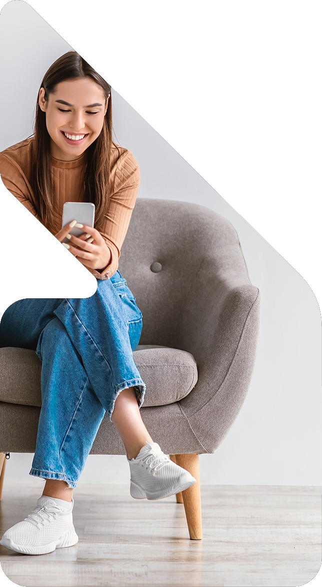 Image showing a woman sitting on a chair using her phone