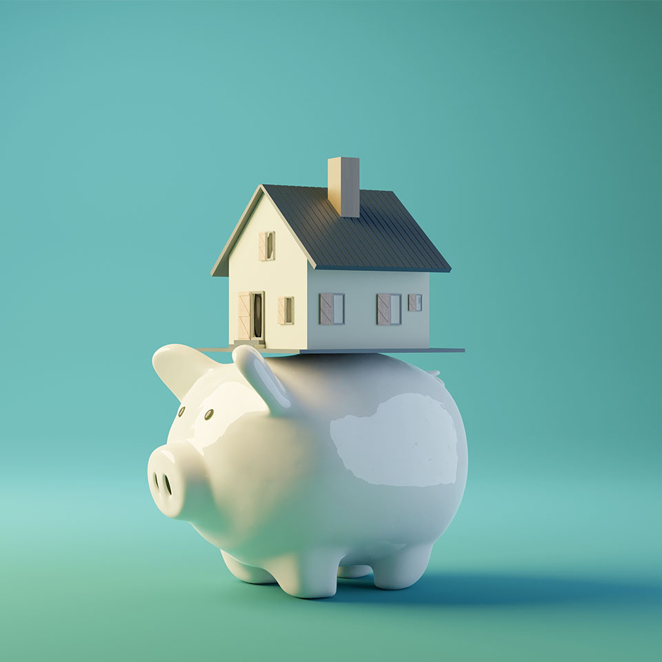 Image showing a model house on top of a piggy bank