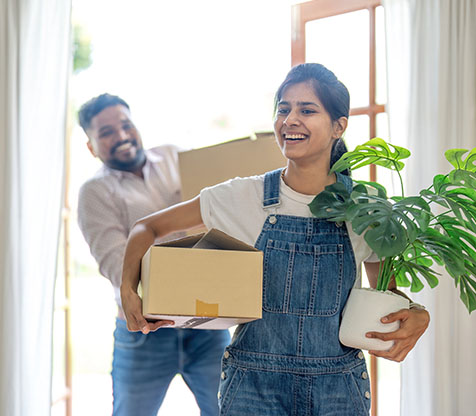 Image showing a couple moving with boxes