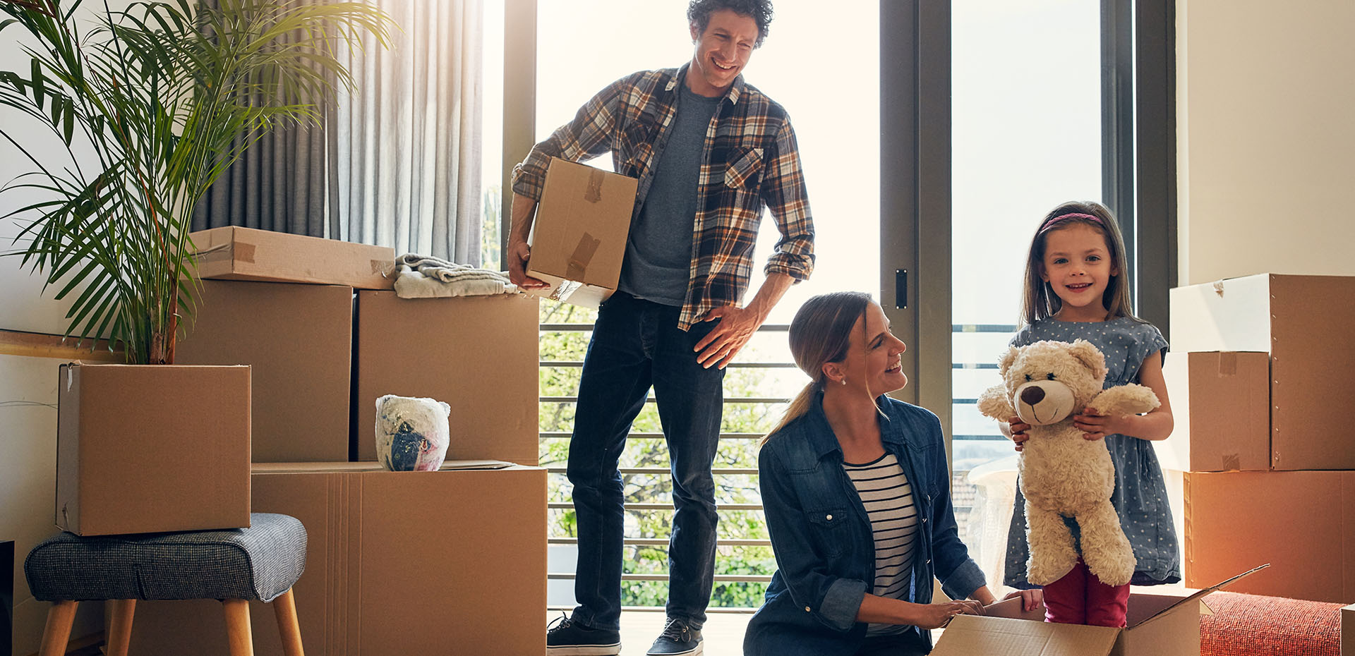 Image showing a family with packing boxes