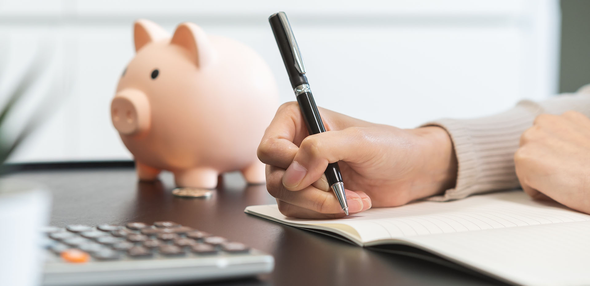 Image showing a close up of a piggy bank and a calculator