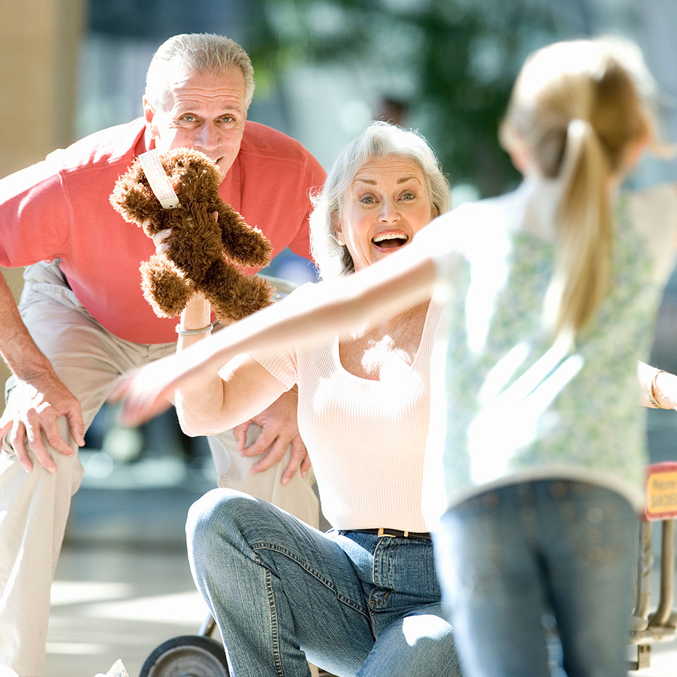 Image showing grandparents greeting their granddaughter at the airport