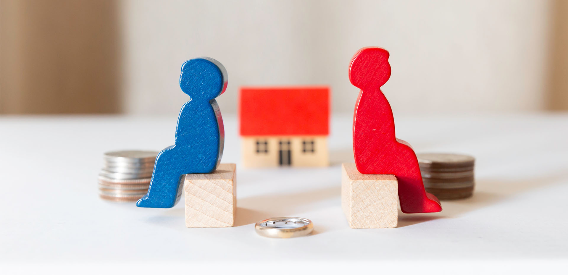 Image showing a model couple facing away from each other in front of a model house