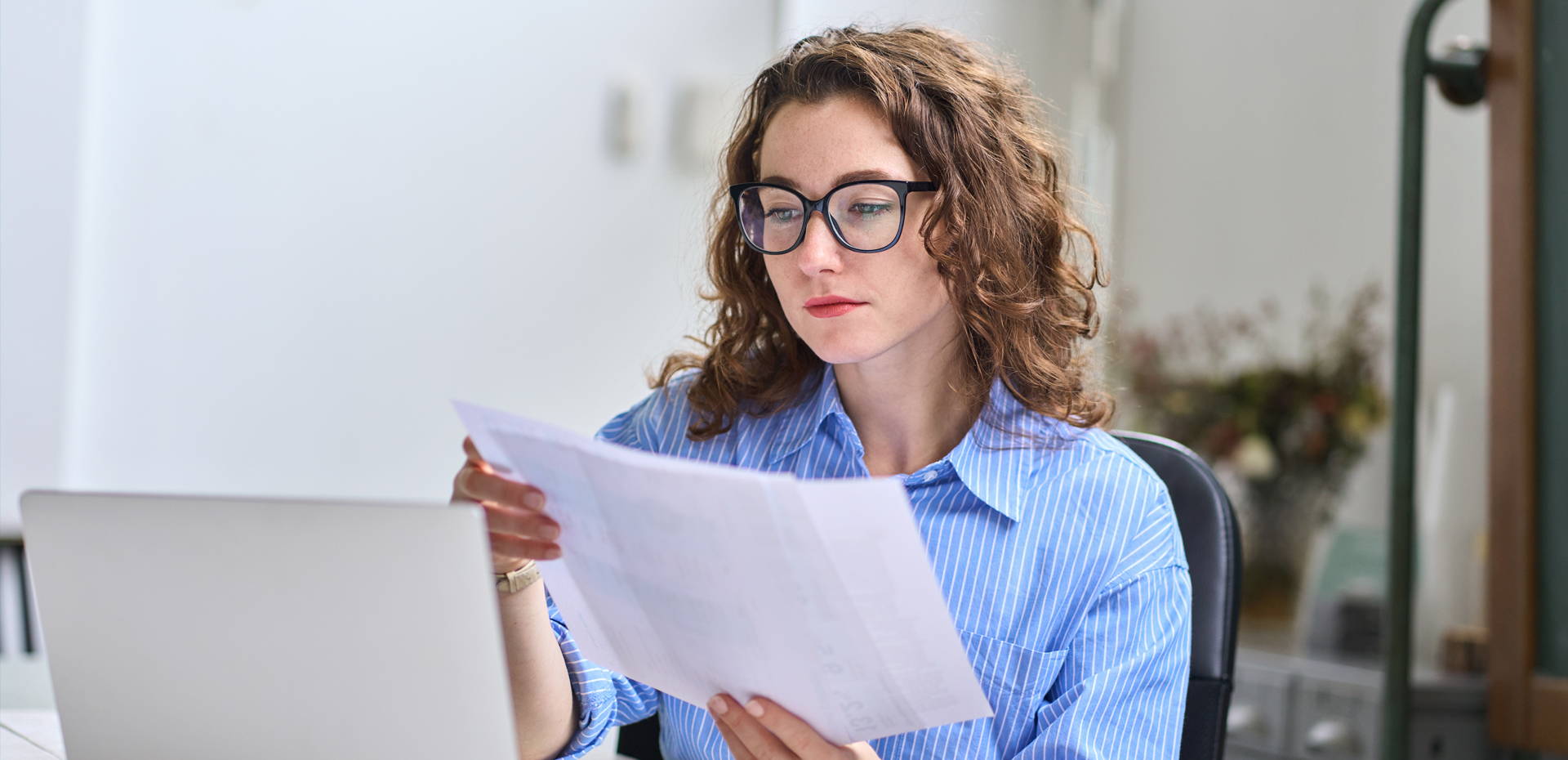 Image showing a woman checking papers