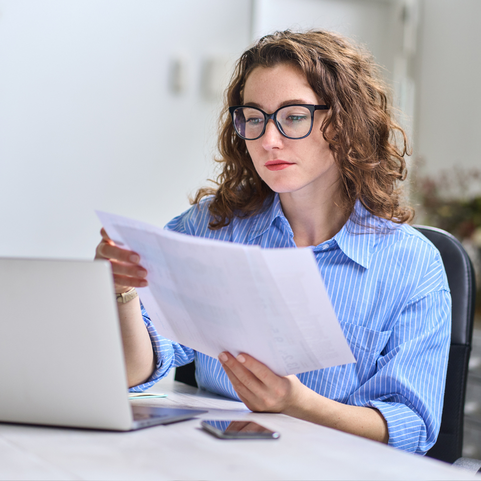 Image showing a woman checking papers