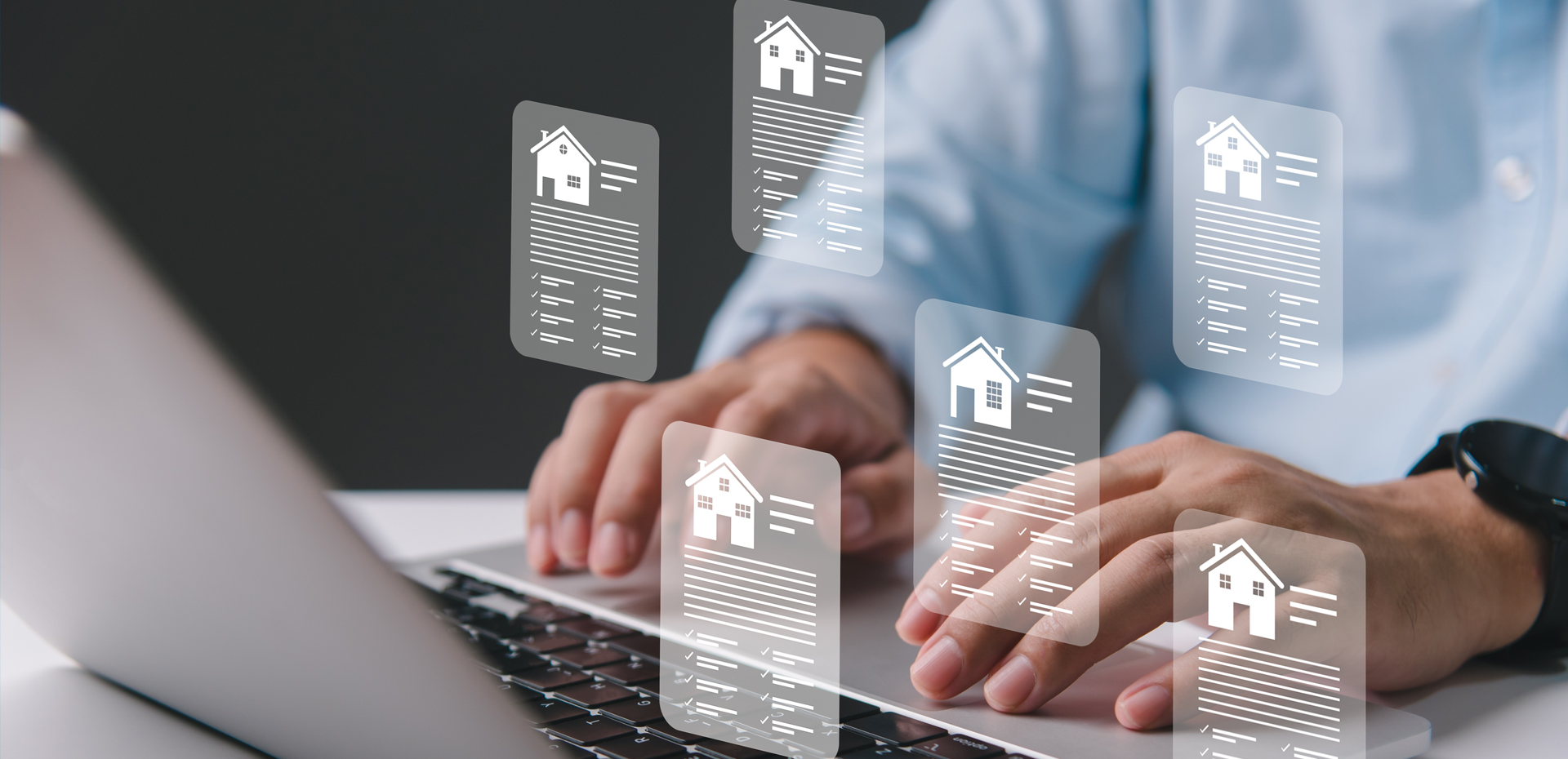 Image showing a man working on a laptop with virtual house details showing