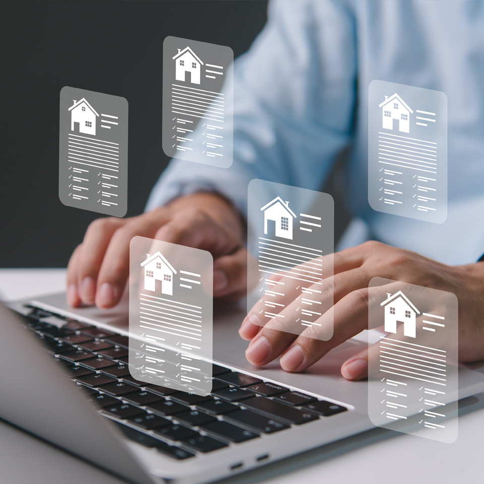 Image showing a man working on a laptop with virtual house details showing