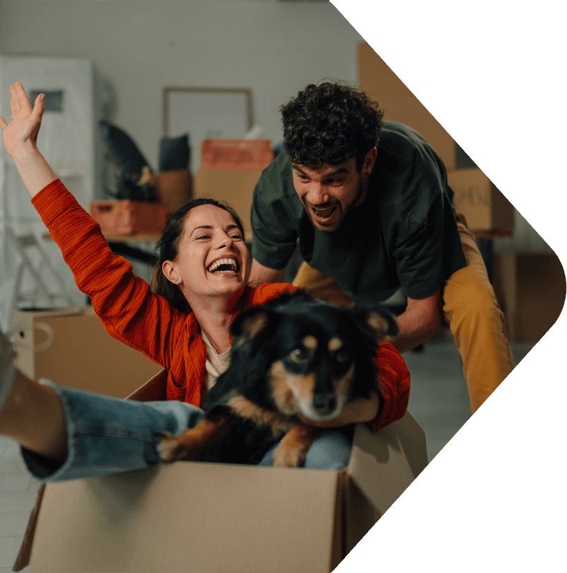 image showing a couple with a a dog in a box having fun