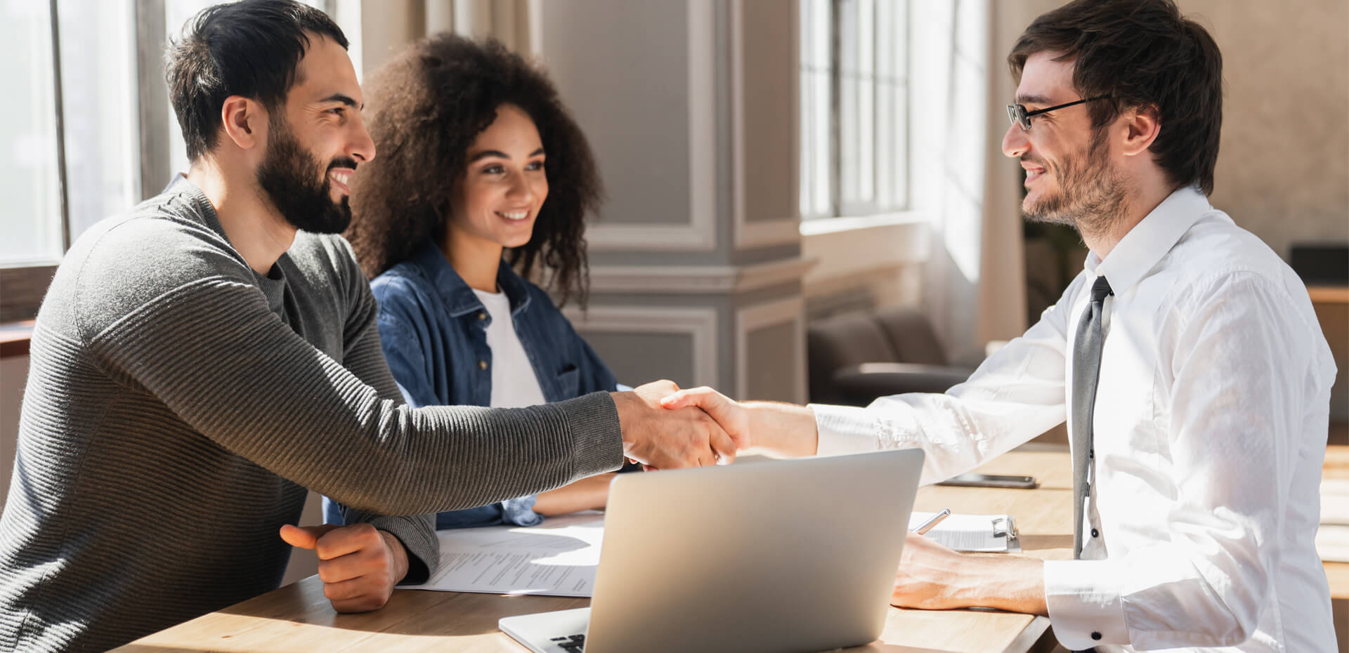 Image Showing couple handshake mortgage officer worker