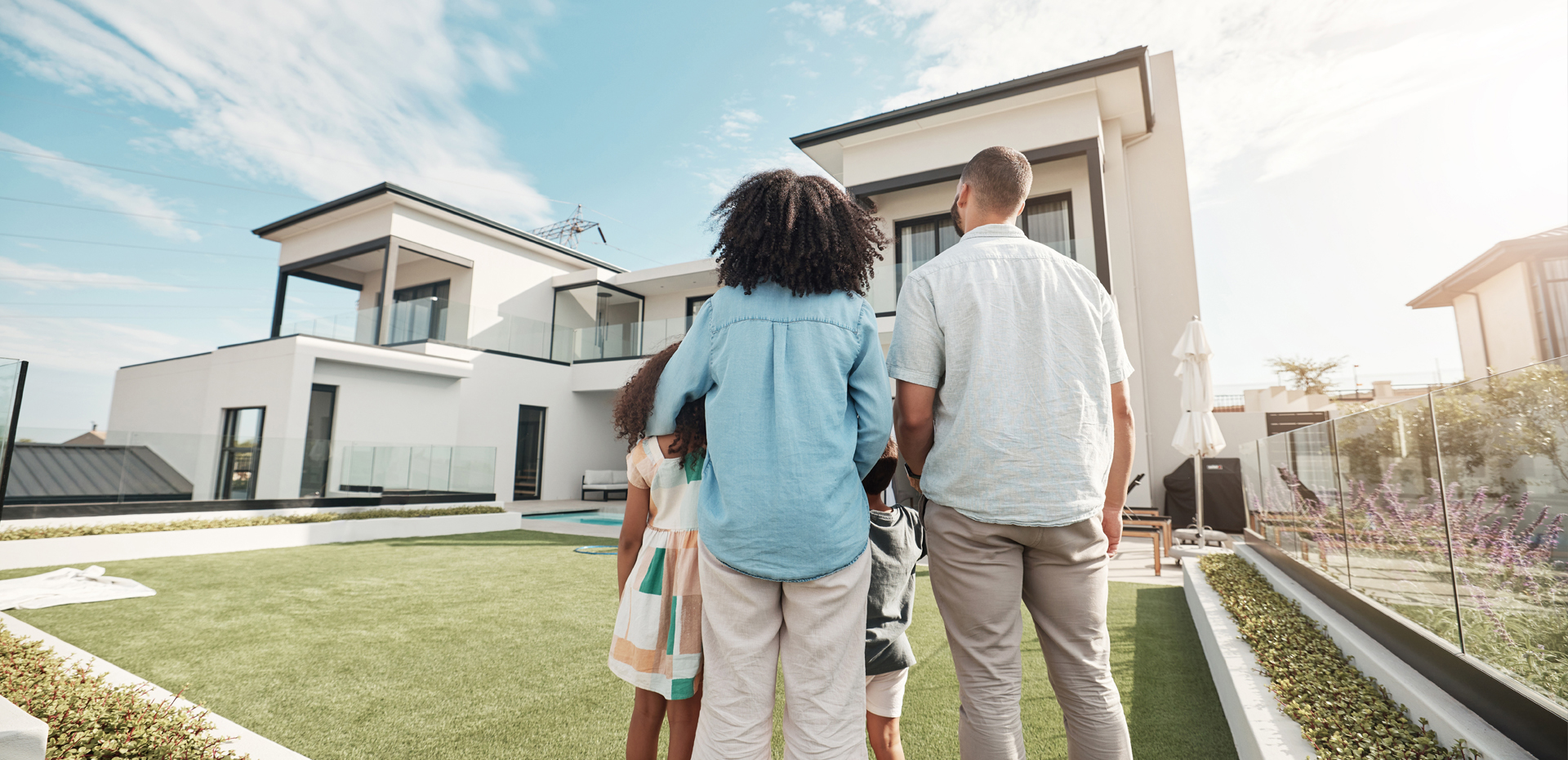 image showing family looking at a new house