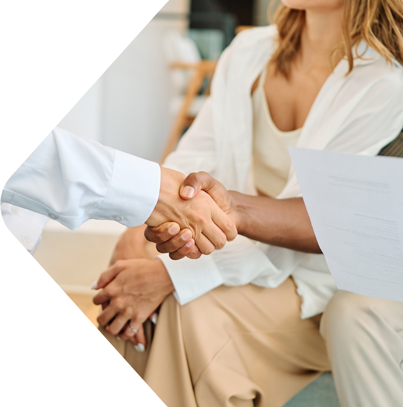 image showing couple and agent shaking hands 
