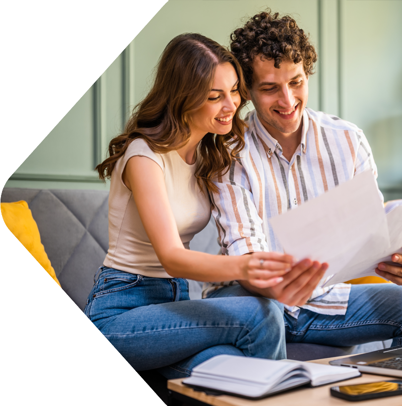 image showing a happy couple looking over documents