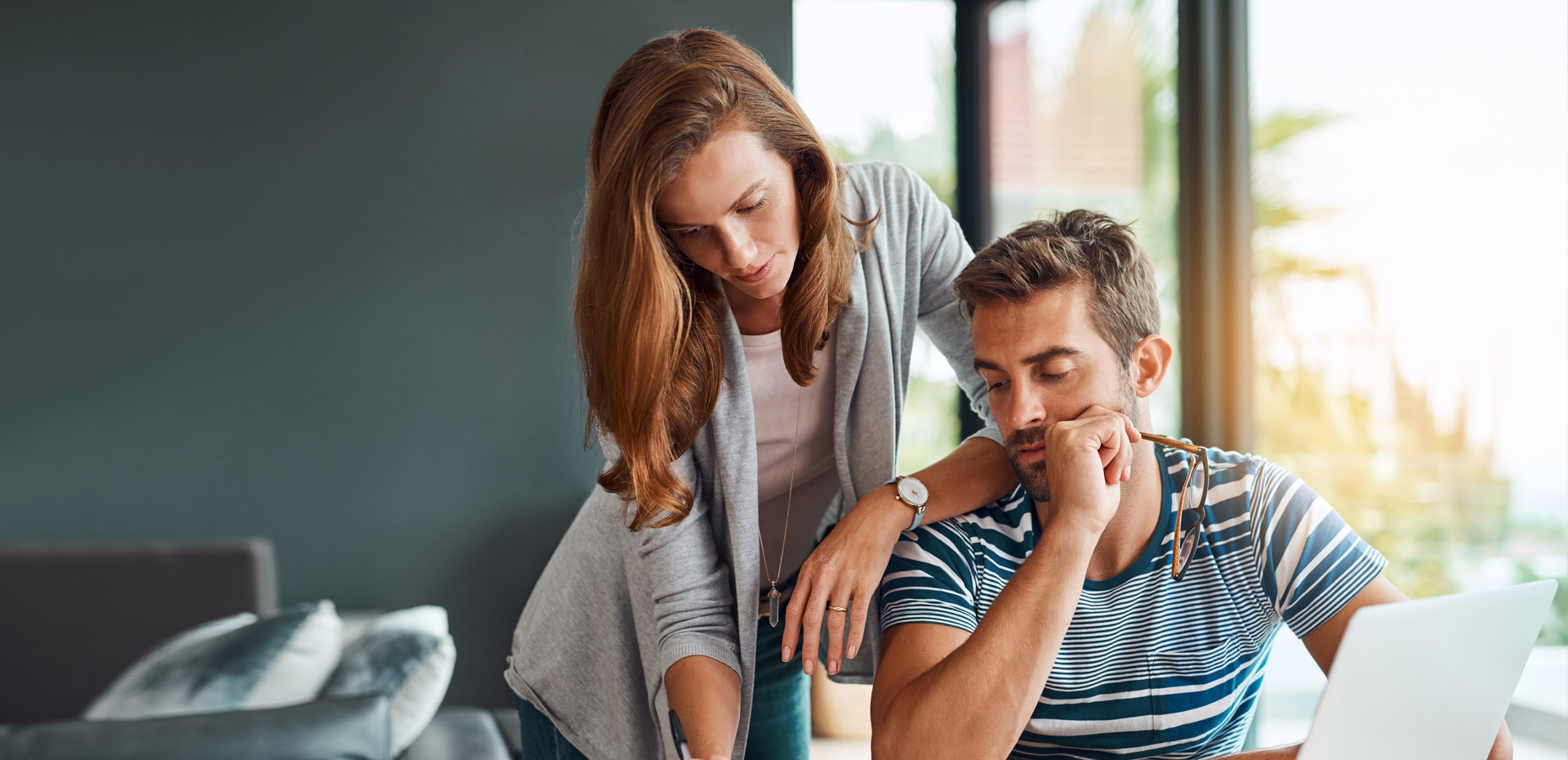 image showing a stressed couple looking over the documents