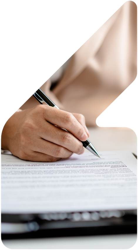 image showing a lady signing documents and a small house