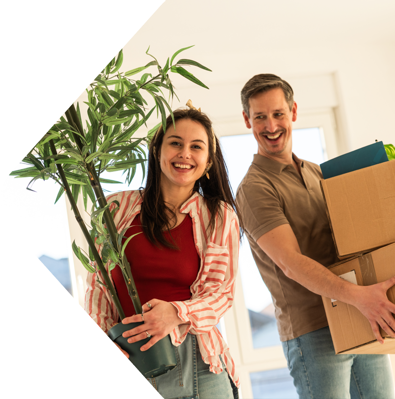 image showing couple moving in holding items
