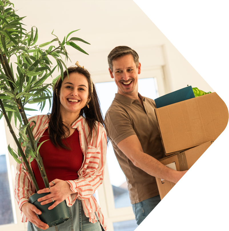 image showing couple moving in holding items