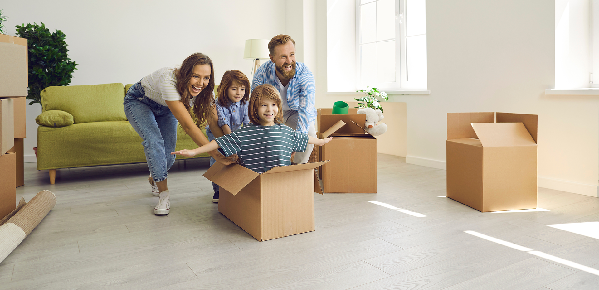 Image showing a family playing in a cardboard box
