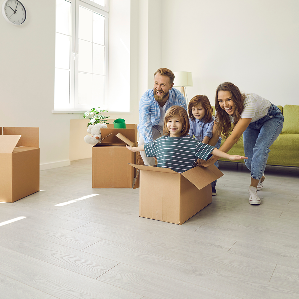 Image showing a family playing in a cardboard box