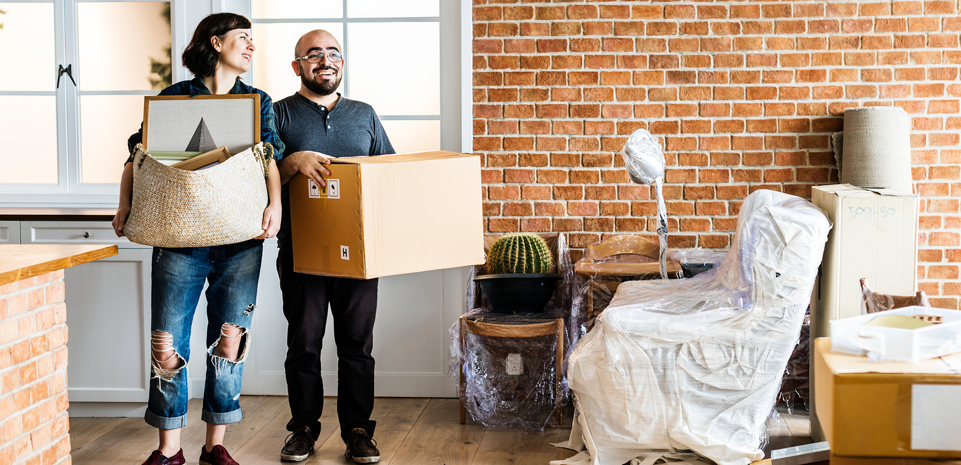 Image showing a couple moving in with boxes