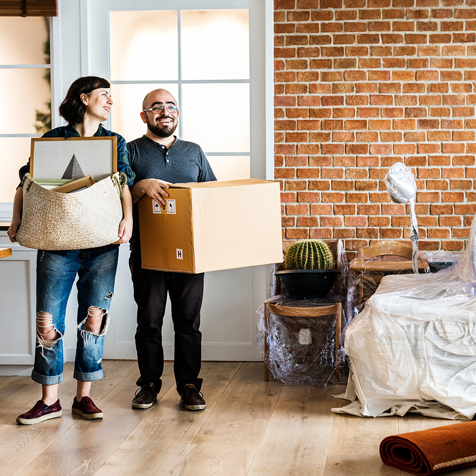 Image showing a couple moving in with boxes