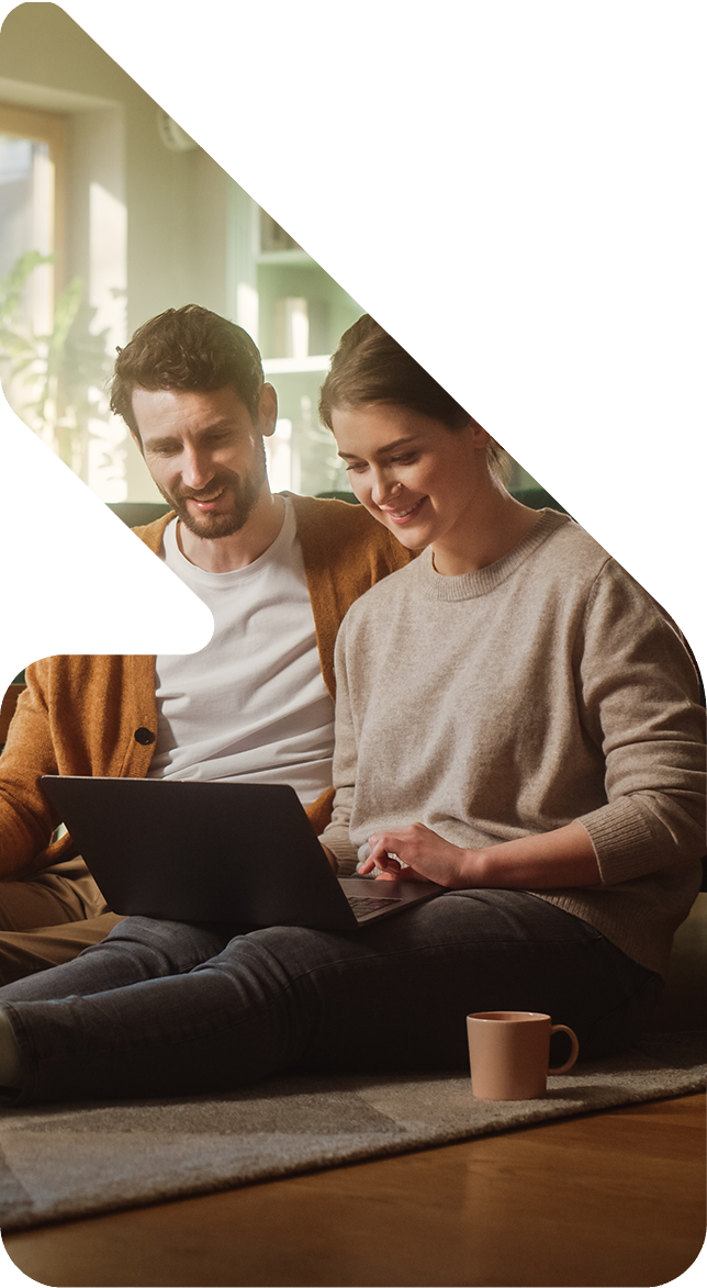 Image showing a couple sitting on the floor with a laptop