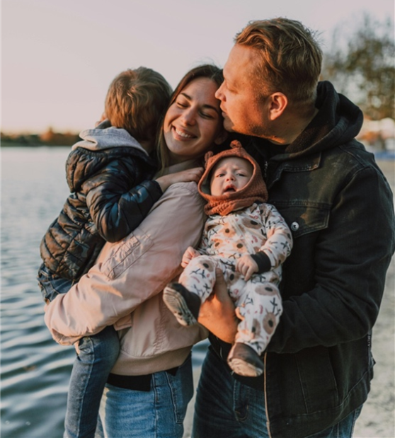 Photo of Adam and Kirsty with their children